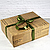 Подарочная упаковка большой коробки "ГАЗЕТА" с зеленым бантом